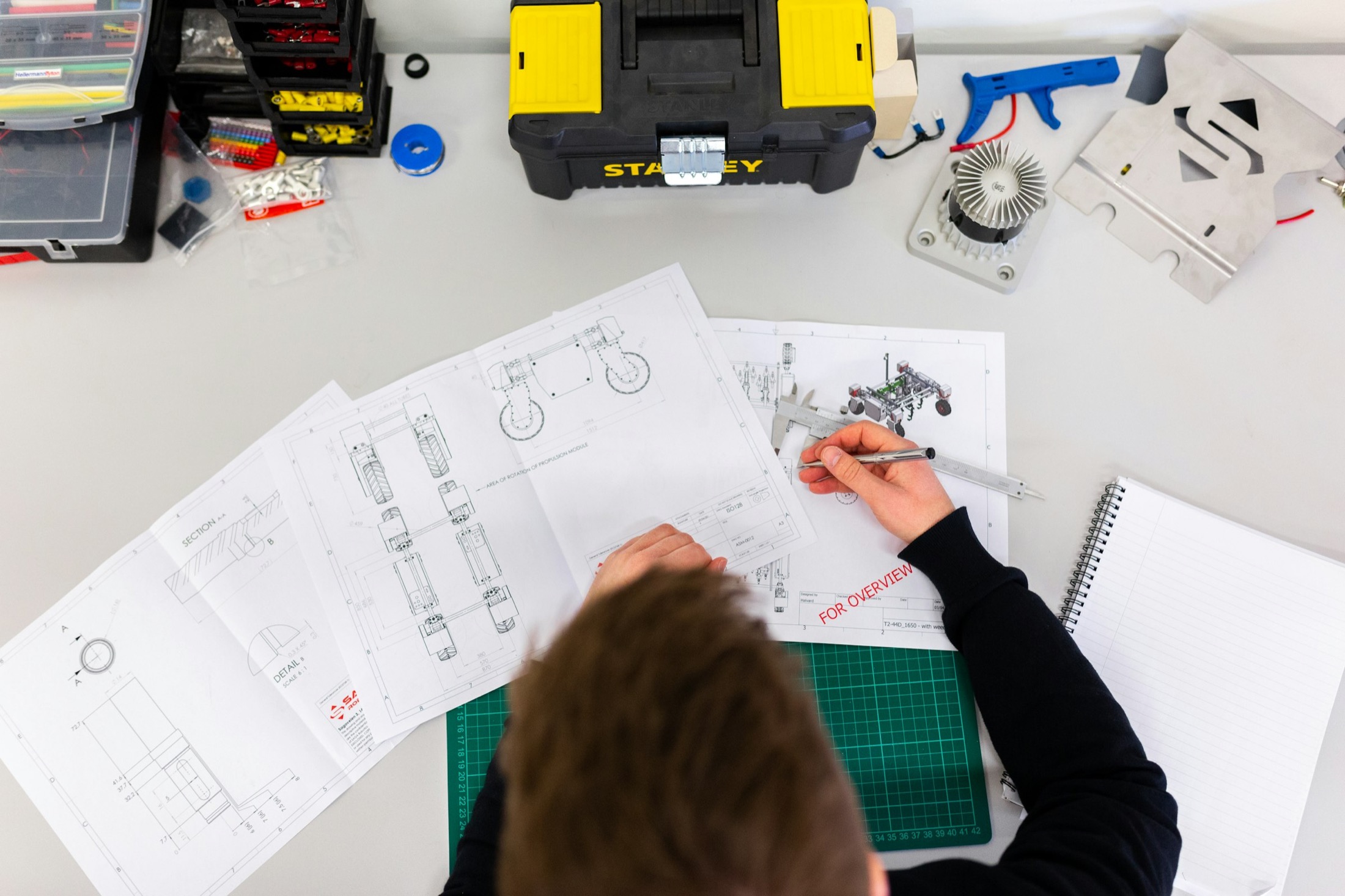 Rover blueprint work on a maker desk